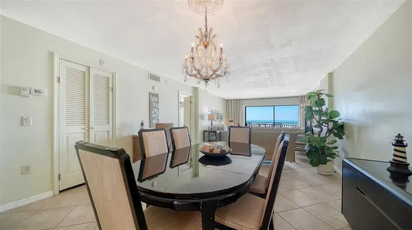 a view of a chairs and table in the balcony