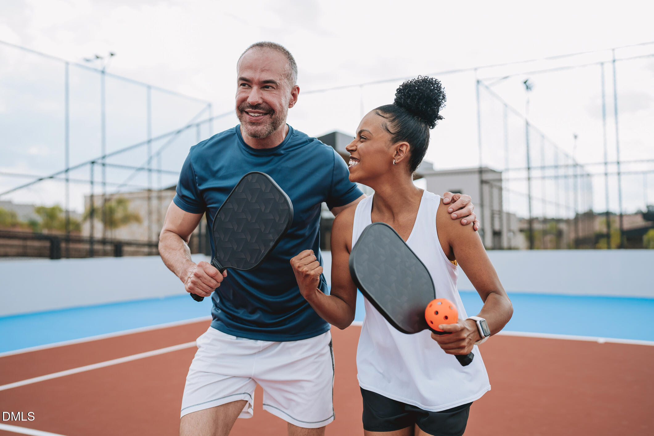 3208 Goldney Road Raleigh, NC 27610 - Photo 27 of 33 Lifestyle_Couple_PlayingPickleball