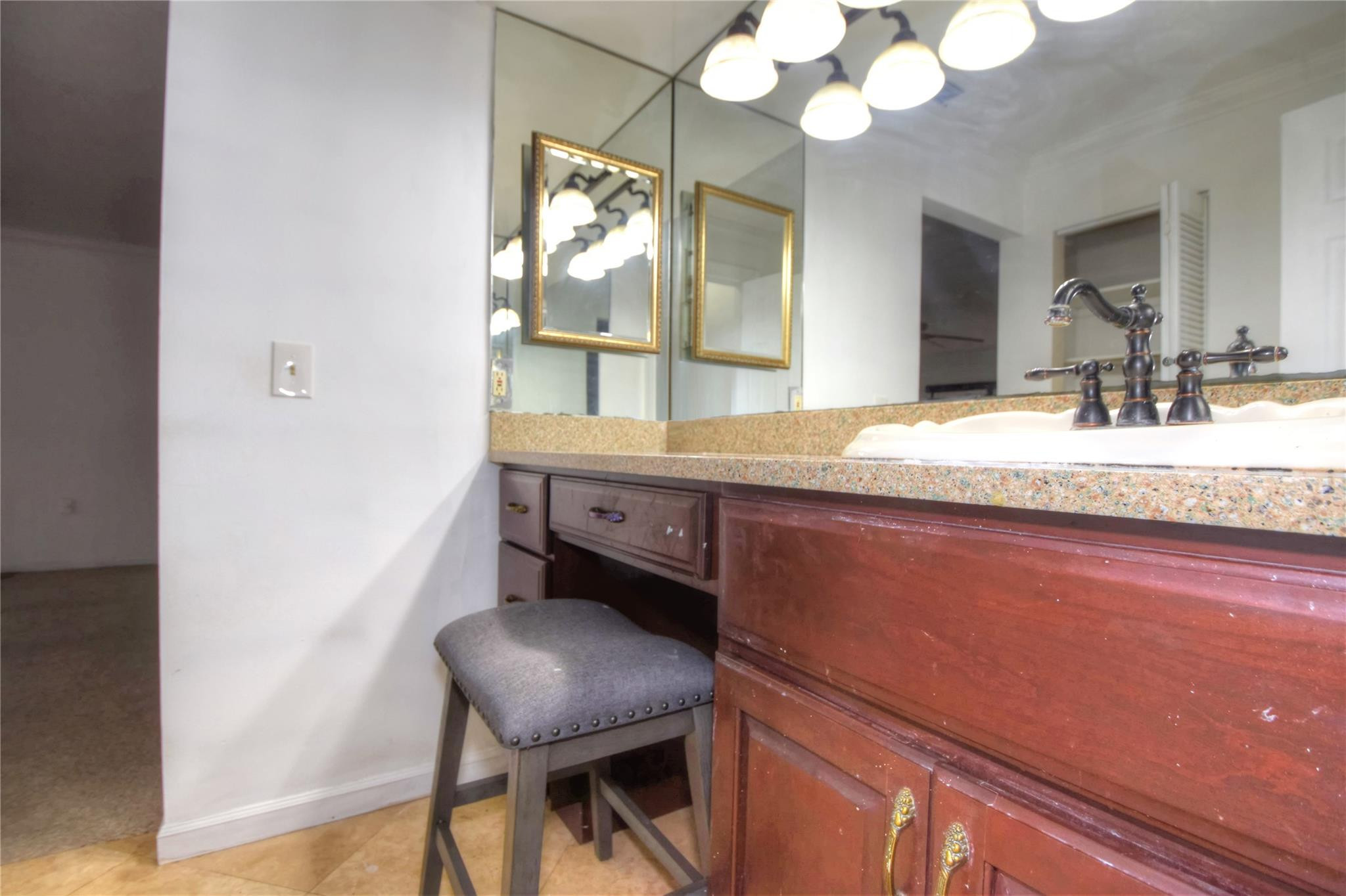 149 Northwest 70th Street, Unit 305C Boca Raton, FL 33487 - Photo 18 of 32 Wood cabinetry with granite counters