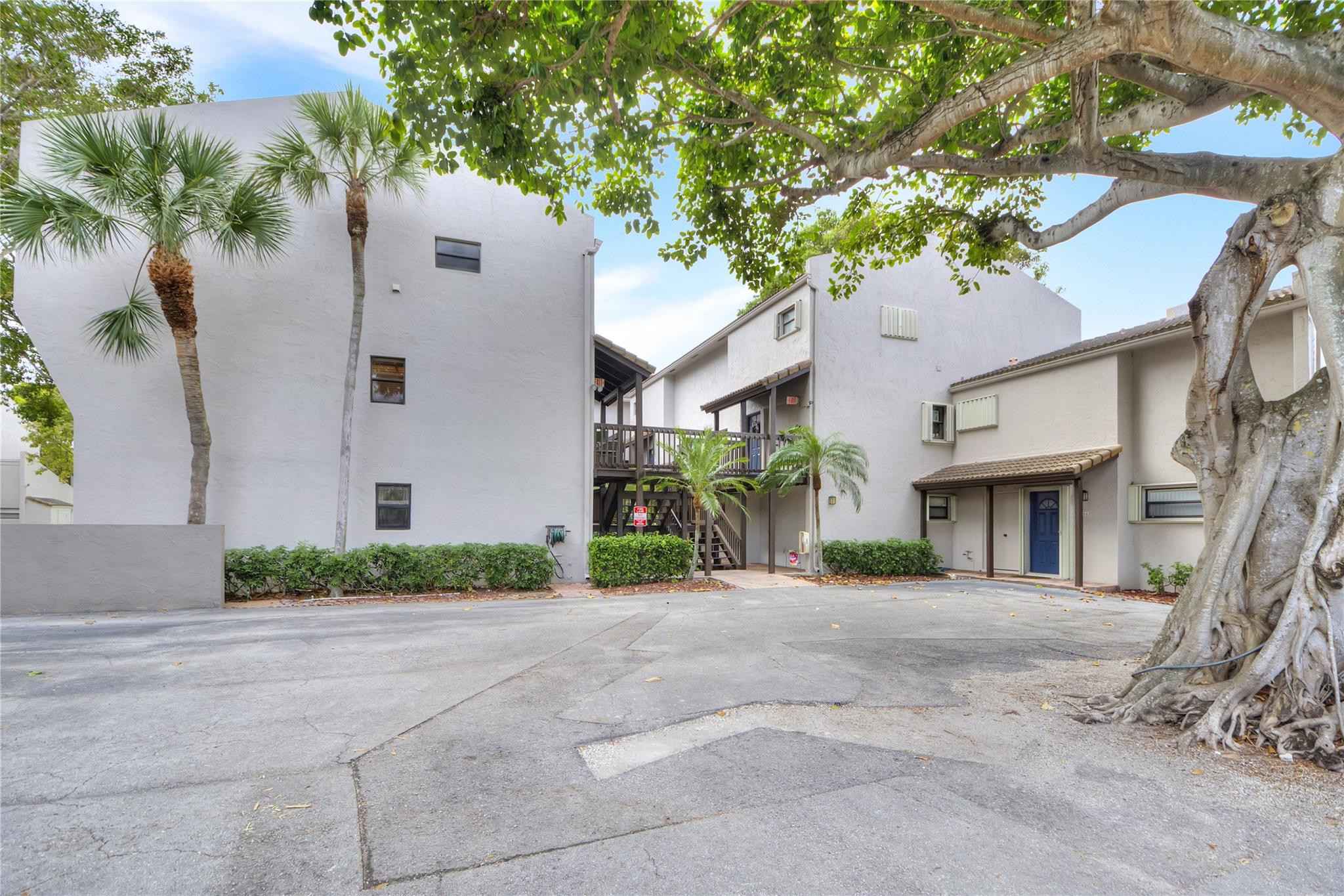 149 Northwest 70th Street, Unit 305C Boca Raton, FL 33487 - Photo 32 of 32 Lovely banyan tree in front of building