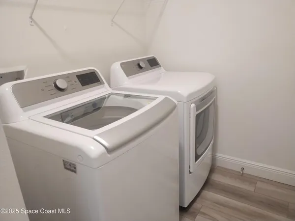 a utility room with dryer and washer
