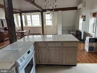 a kitchen with a sink and a stove top oven