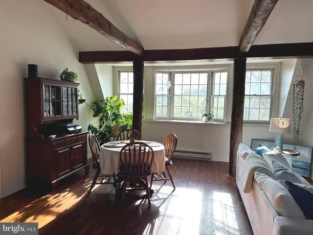 a view of a dining room with furniture window and outside view