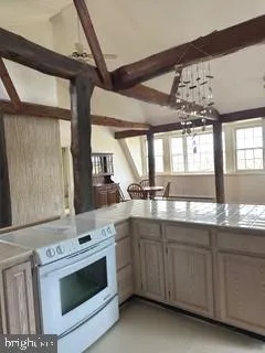 a kitchen with a stove and a sink