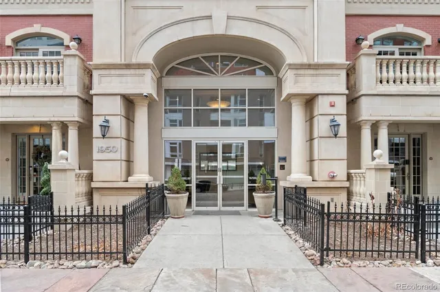 a view of a brick house with large windows
