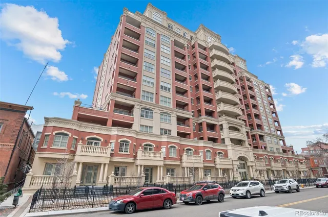 a bedroom with furniture a bed and a potted plant