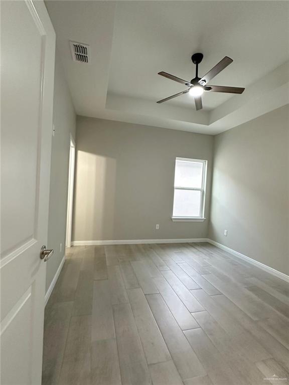 5704 Swallow Avenue, Unit 3 McAllen, TX 78573 - Photo 15 of 21 wooden floor in an empty room