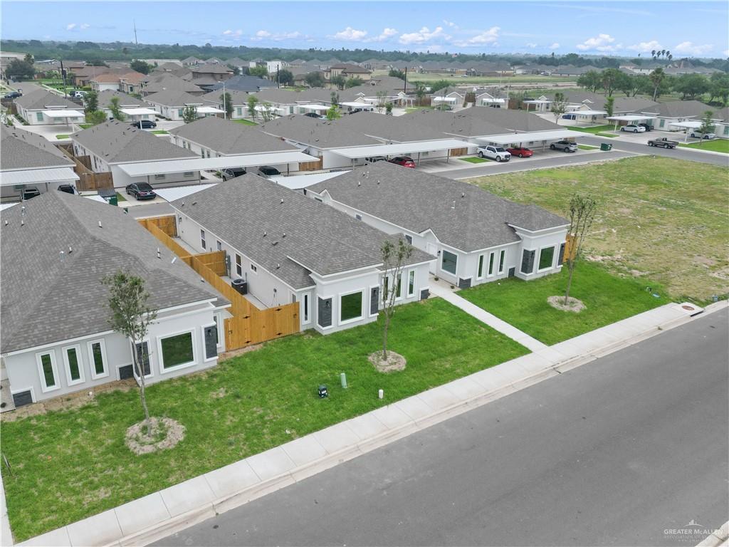5704 Swallow Avenue, Unit 3 McAllen, TX 78573 - Photo 3 of 21 an aerial view of multiple houses with a yard