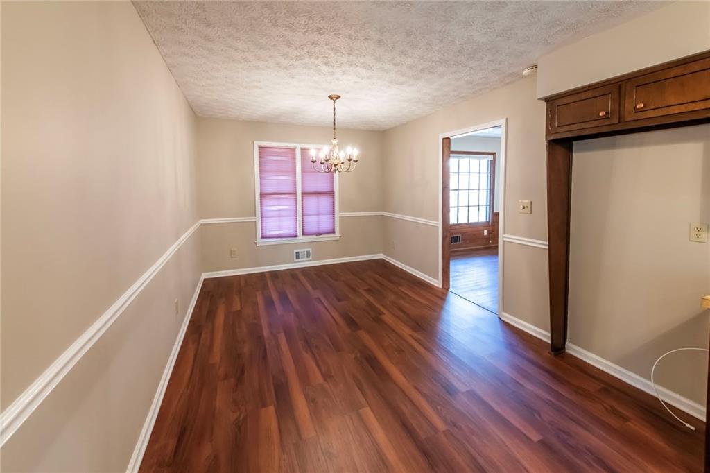 4597 East Glen Ridge Circle Winston, GA 30187 - Photo 19 of 38 wooden floor in an empty room with a window