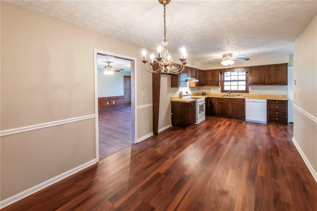 4597 East Glen Ridge Circle Winston, GA 30187 - Photo 20 of 38 a view of a kitchen and dining room with wooden floor