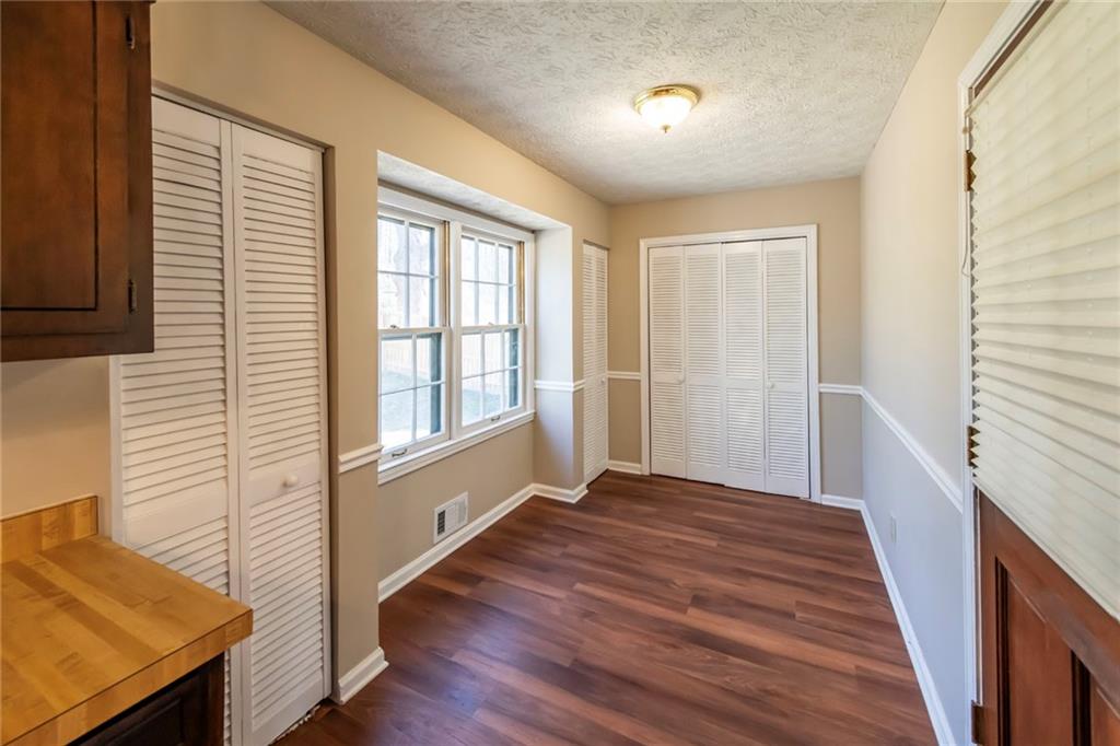 4597 East Glen Ridge Circle Winston, GA 30187 - Photo 21 of 38 a view of a livingroom with wooden floor and a window