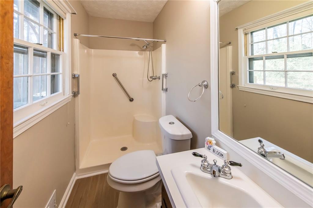 4597 East Glen Ridge Circle Winston, GA 30187 - Photo 27 of 38 a bathroom with a sink toilet and shower