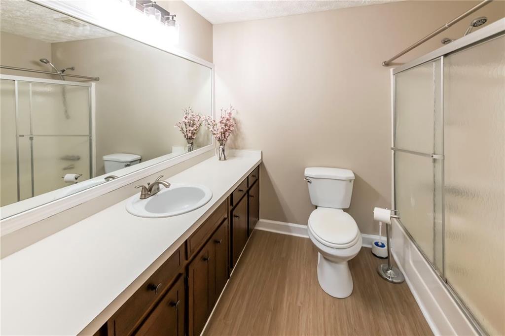 4597 East Glen Ridge Circle Winston, GA 30187 - Photo 28 of 38 a bathroom with a sink toilet and shower