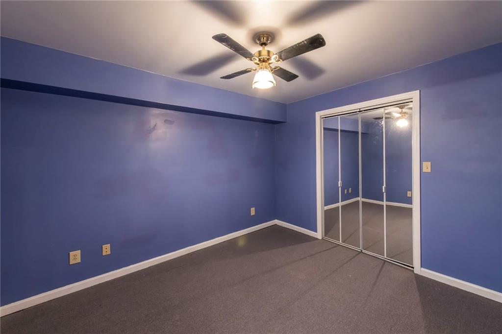 4597 East Glen Ridge Circle Winston, GA 30187 - Photo 30 of 38 an empty room with closet and fan