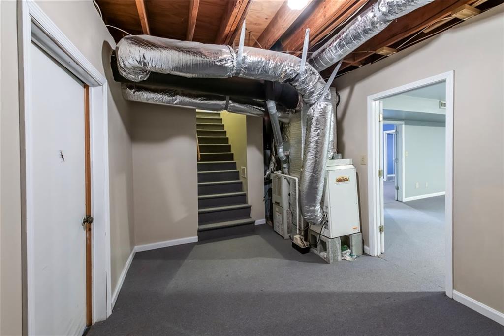 4597 East Glen Ridge Circle Winston, GA 30187 - Photo 34 of 38 a view of walk in closet with clothes and shoes