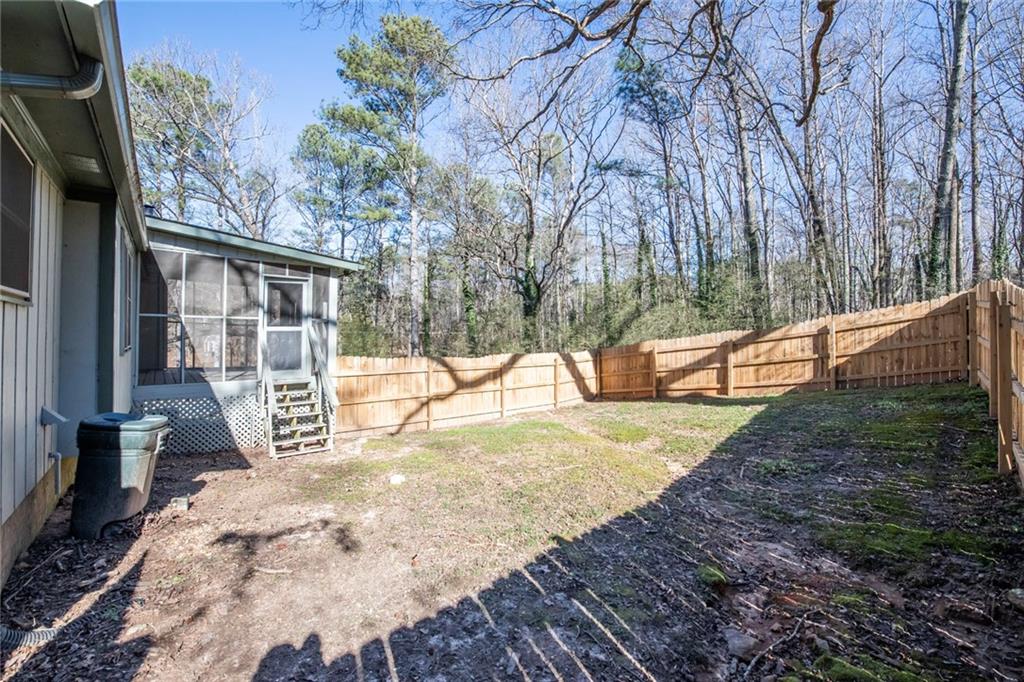 4597 East Glen Ridge Circle Winston, GA 30187 - Photo 6 of 38 a view of a backyard with large trees