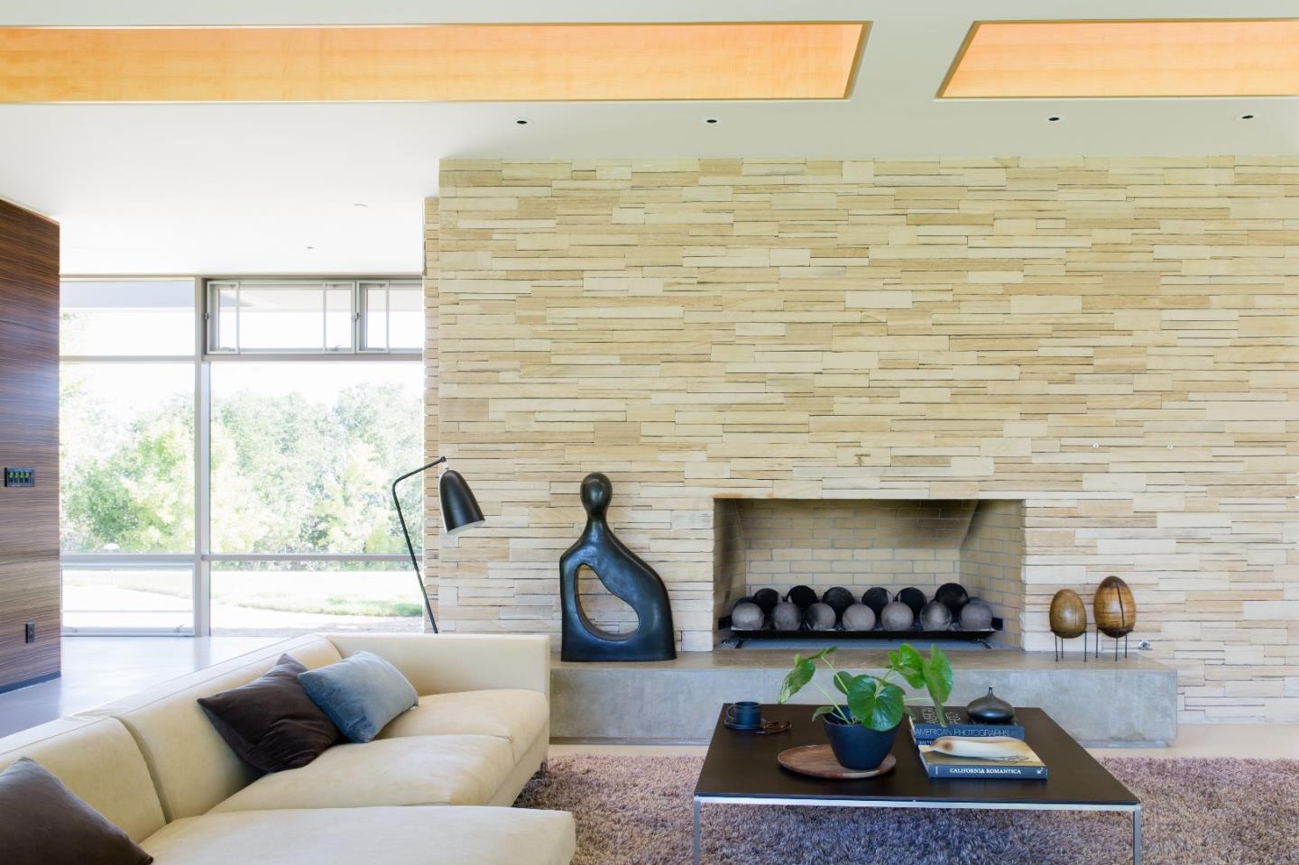 12950 Robleda Road Los Altos Hills, CA 94022 - Photo 13 of 39 a living room with furniture wooden floor and a fireplace