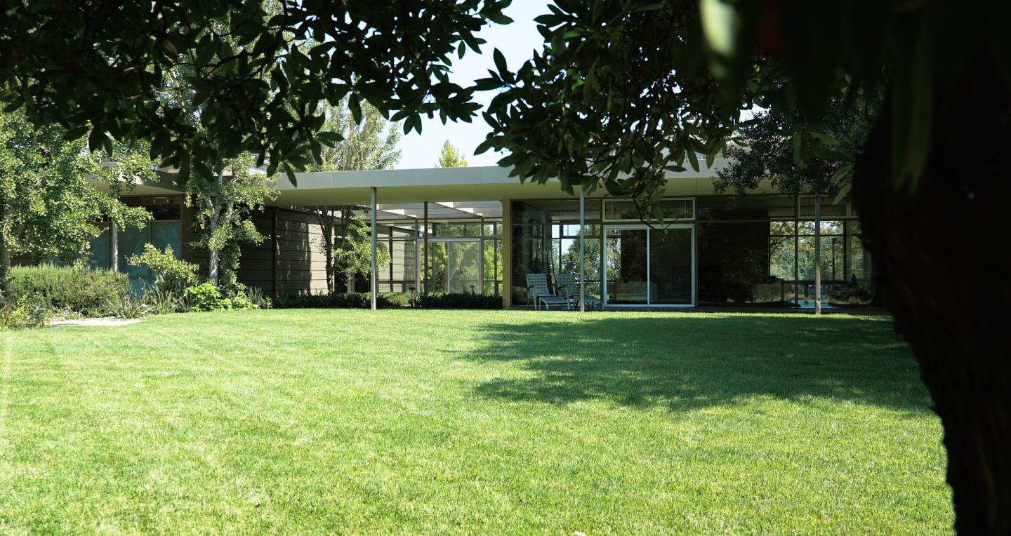 12950 Robleda Road Los Altos Hills, CA 94022 - Photo 26 of 39 a front view of a house with a garden