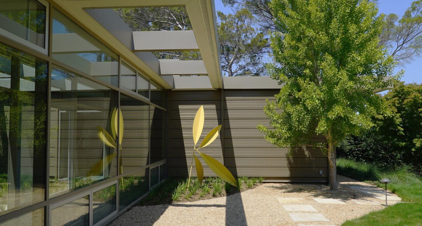 12950 Robleda Road Los Altos Hills, CA 94022 - Photo 5 of 39 a front view of a house with a yard