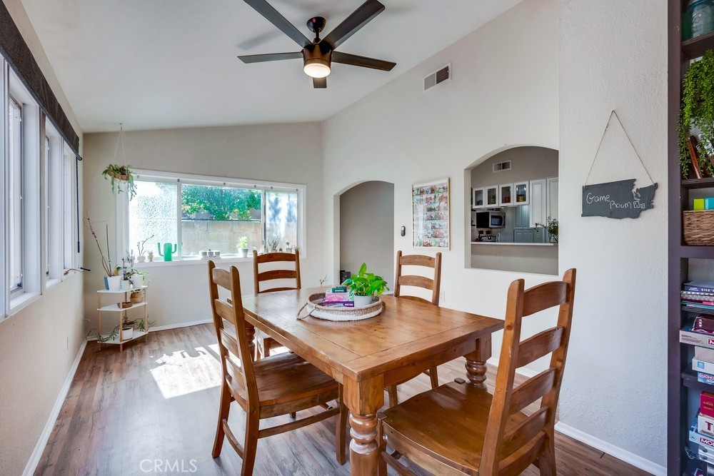 930 Countryside Street Hemet, CA 92545 - Photo 11 of 45 a view of a dining room with furniture window and wooden floor