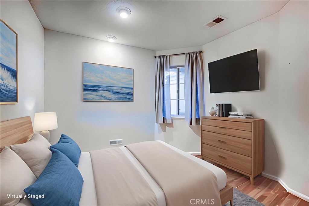 930 Countryside Street Hemet, CA 92545 - Photo 15 of 45 a bedroom with a bed and a flat screen tv