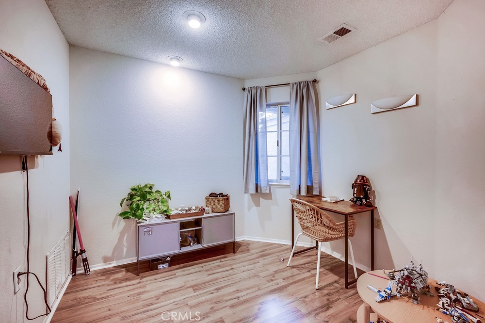 930 Countryside Street Hemet, CA 92545 - Photo 19 of 45 a workspace room with furniture and wooden floor