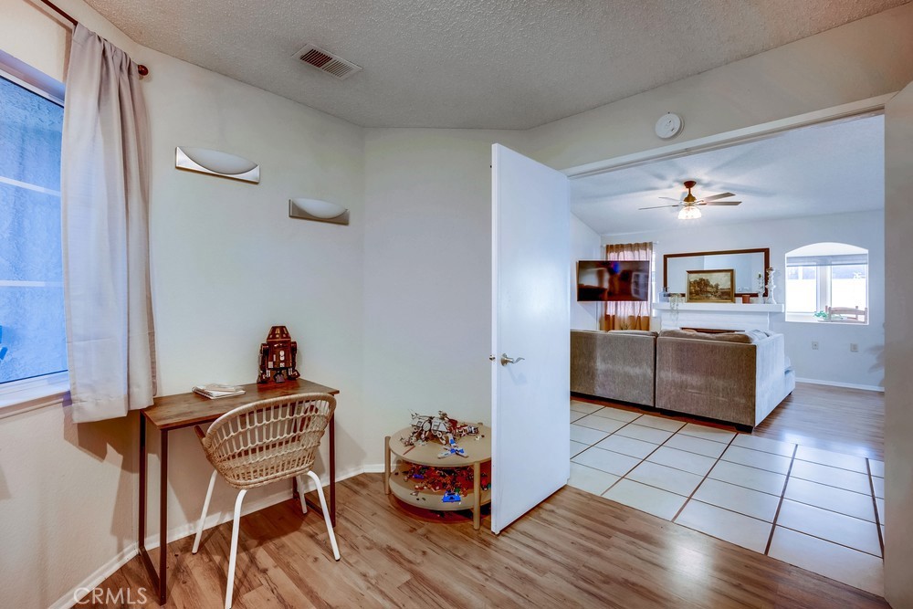 930 Countryside Street Hemet, CA 92545 - Photo 20 of 45 a living room with furniture and a kitchen area