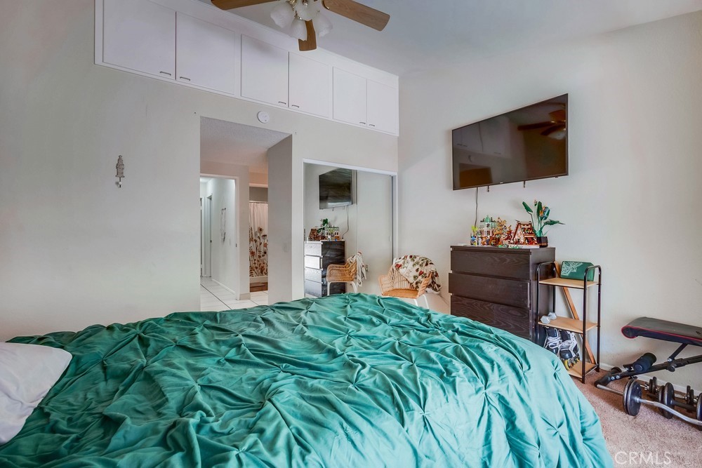 930 Countryside Street Hemet, CA 92545 - Photo 23 of 45 a bedroom with a bed and a flat screen tv