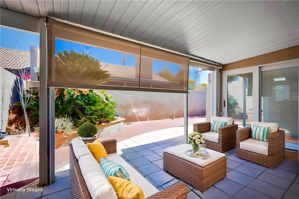 930 Countryside Street Hemet, CA 92545 - Photo 38 of 45 a living room with patio furniture and a potted plant