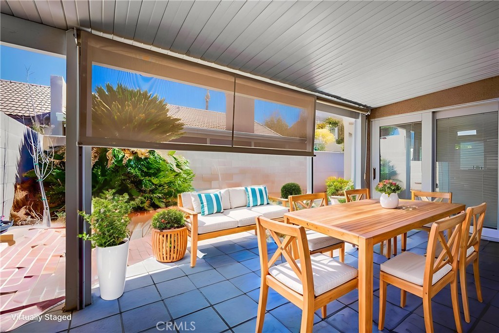 930 Countryside Street Hemet, CA 92545 - Photo 4 of 45 a view of an outdoor dining space with a table and chairs