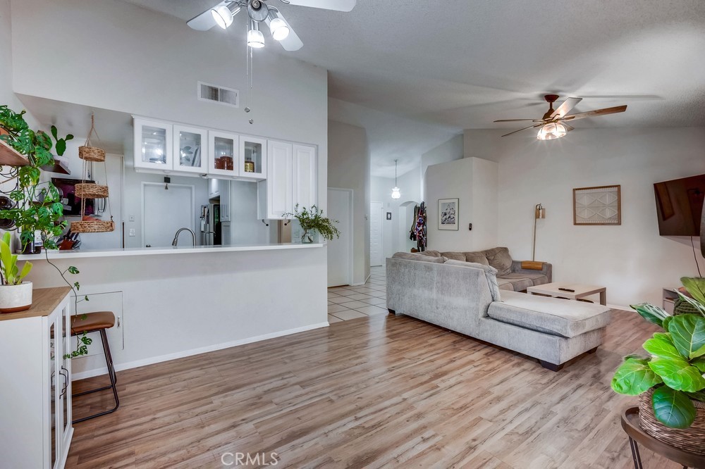 930 Countryside Street Hemet, CA 92545 - Photo 5 of 45 a living room with furniture and a wooden floor