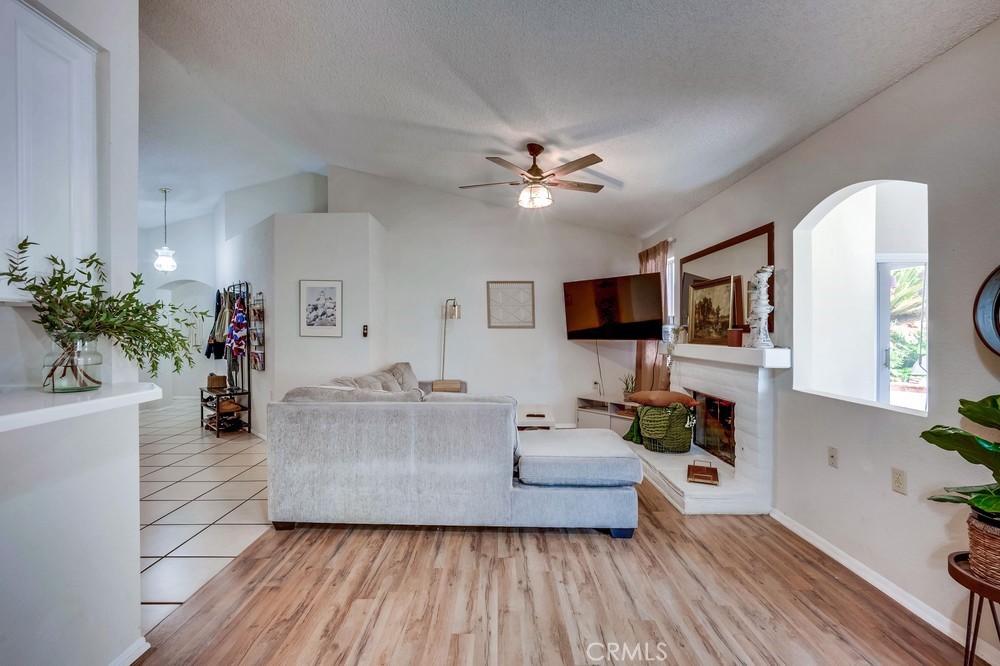 930 Countryside Street Hemet, CA 92545 - Photo 6 of 45 a living room with furniture and a flat screen tv
