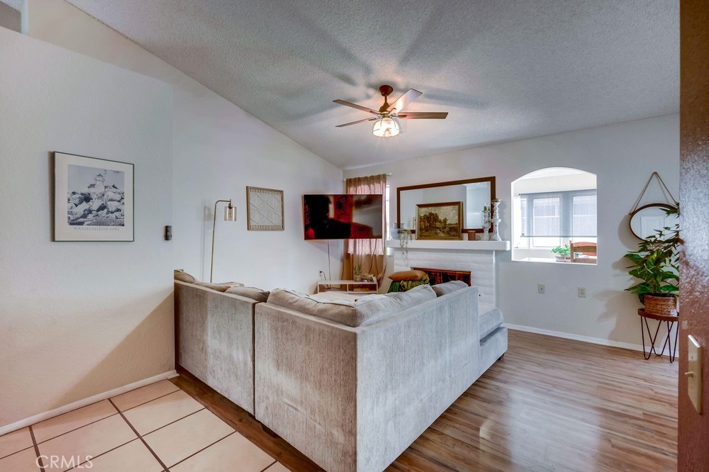 930 Countryside Street Hemet, CA 92545 - Photo 7 of 45 a living room with furniture and wooden floor