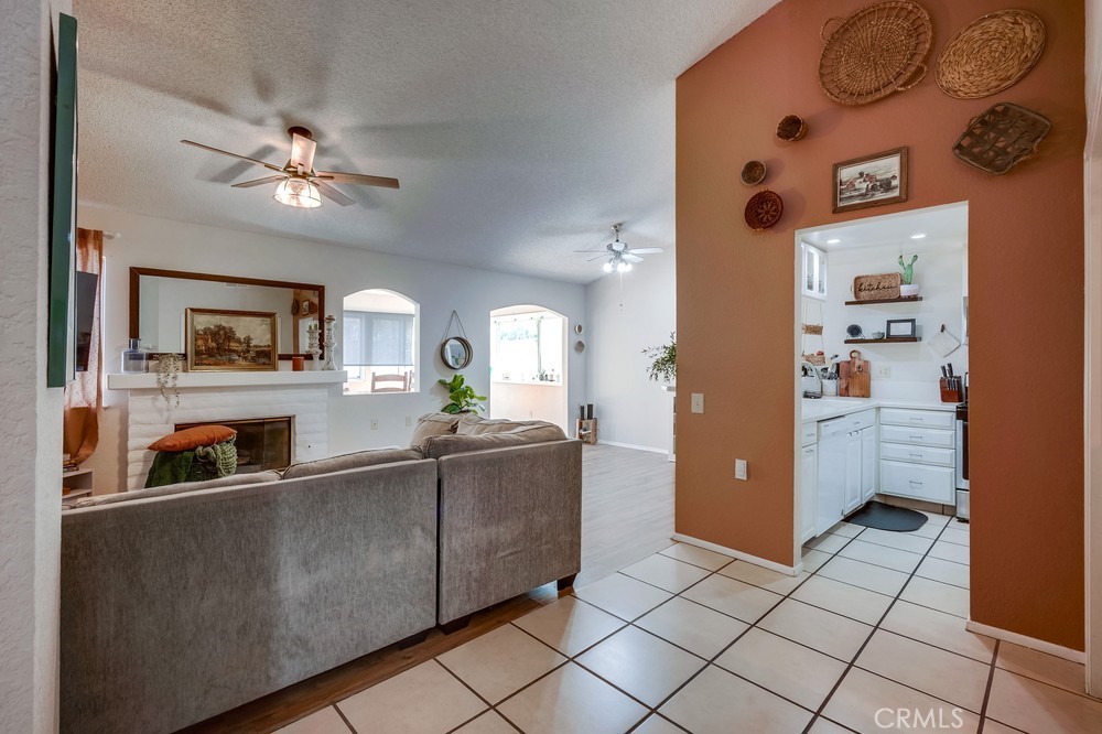 930 Countryside Street Hemet, CA 92545 - Photo 8 of 45 a living room with furniture and a flat screen tv