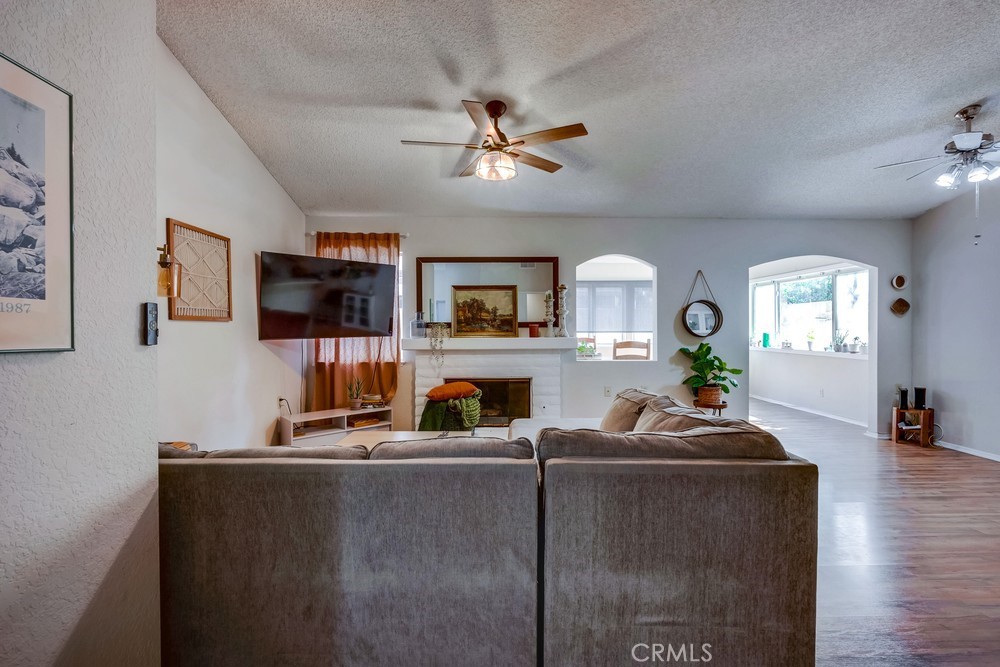 930 Countryside Street Hemet, CA 92545 - Photo 9 of 45 a living room with furniture and a flat screen tv