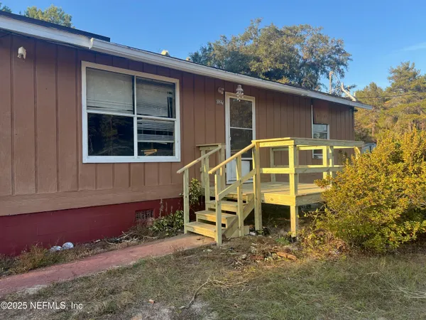 front view of a house with a yard