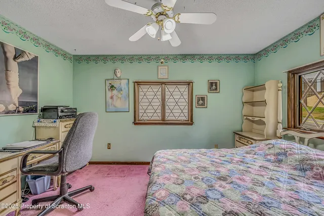a view of a dining room with furniture and a chandelier