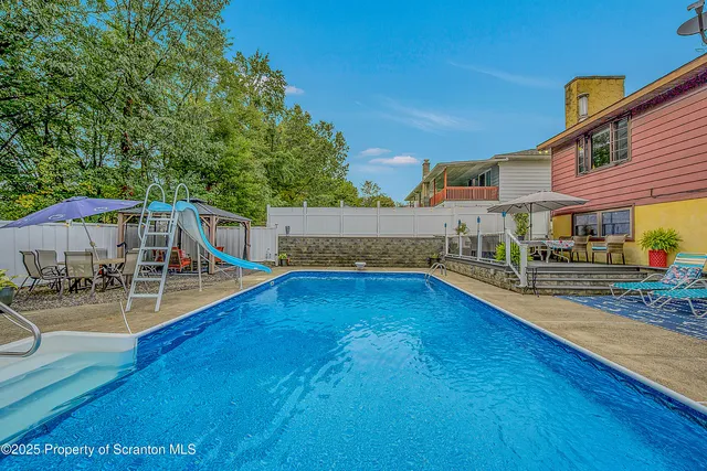 swimming pool with outdoor seating