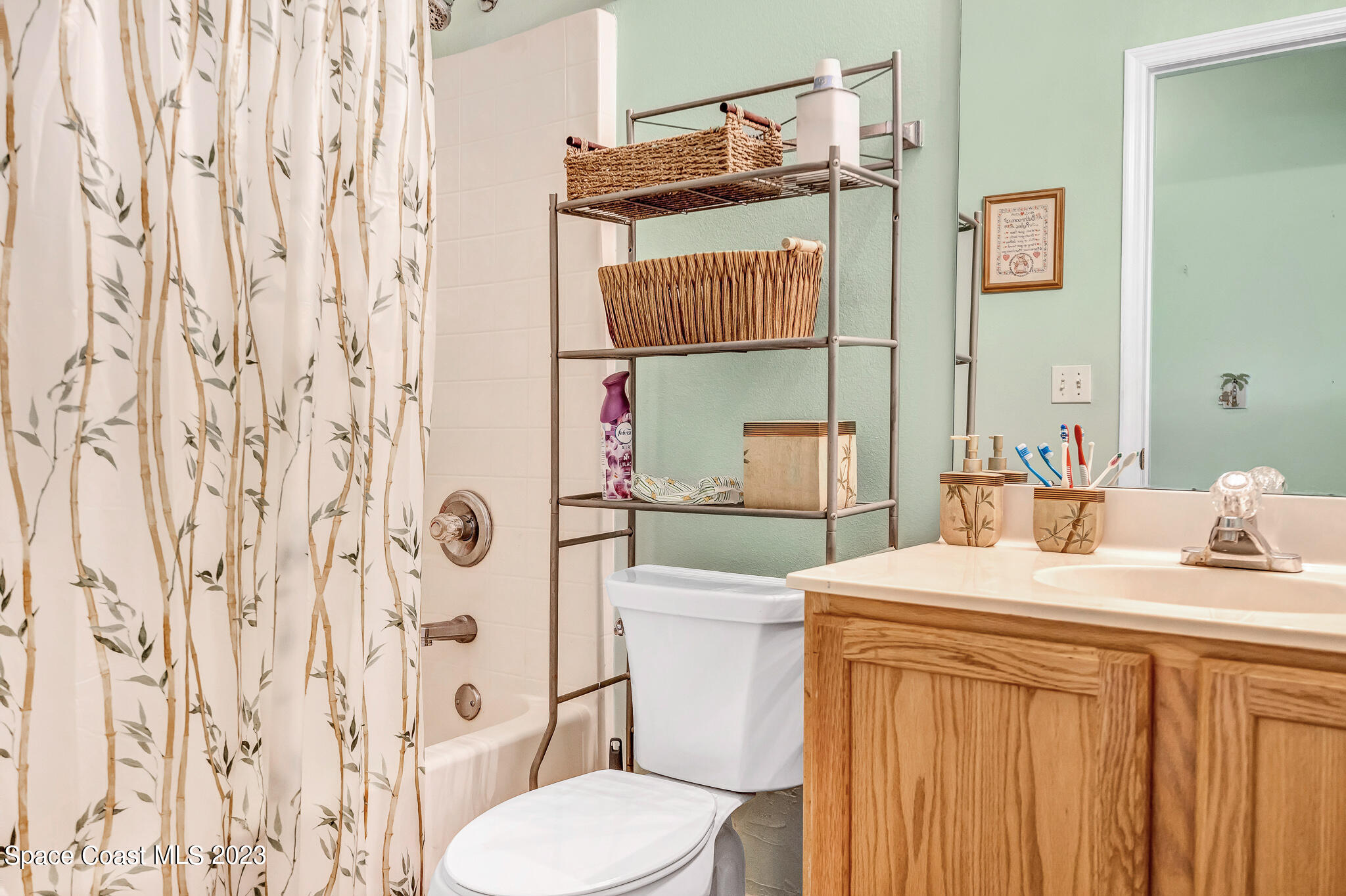 1149 White Oak Circle Melbourne, FL 32934 - Photo 11 of 55 a bathroom with a sink toilet and shower