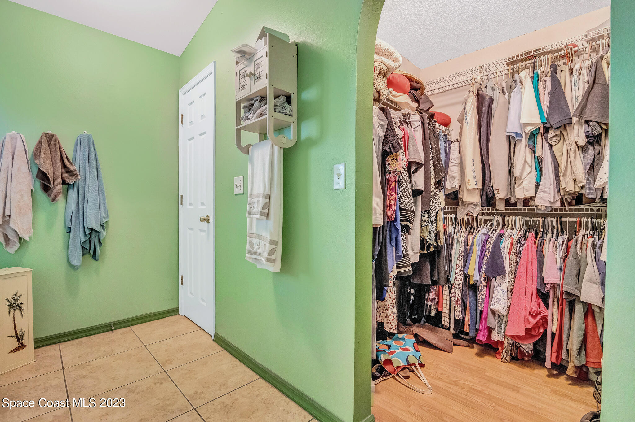 1149 White Oak Circle Melbourne, FL 32934 - Photo 16 of 55 a view of walk in closet with clothes