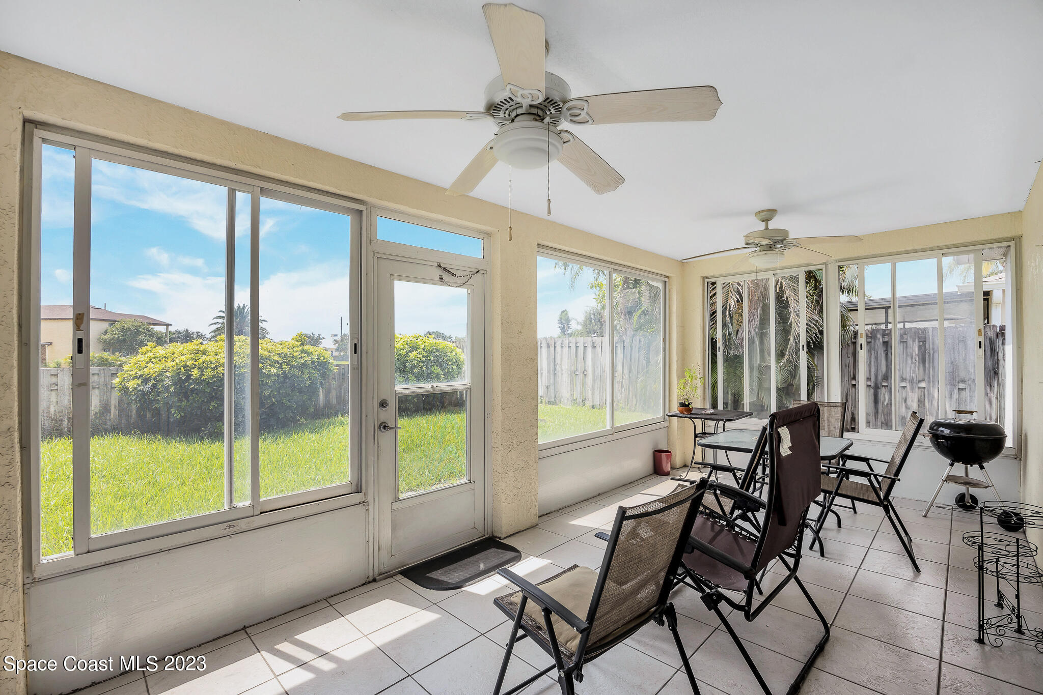 1149 White Oak Circle Melbourne, FL 32934 - Photo 17 of 55 a living room with furniture and a large window