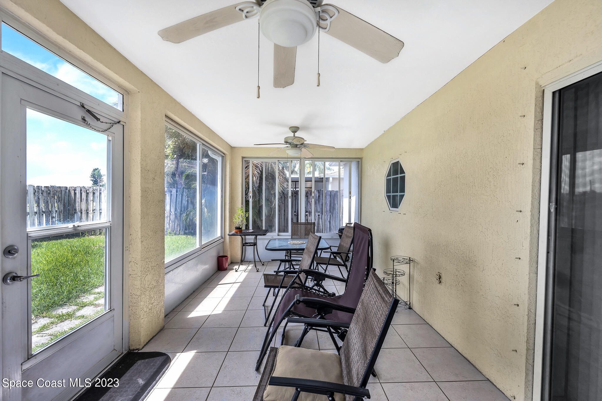 1149 White Oak Circle Melbourne, FL 32934 - Photo 18 of 55 a view of a dining room with furniture window and outside view