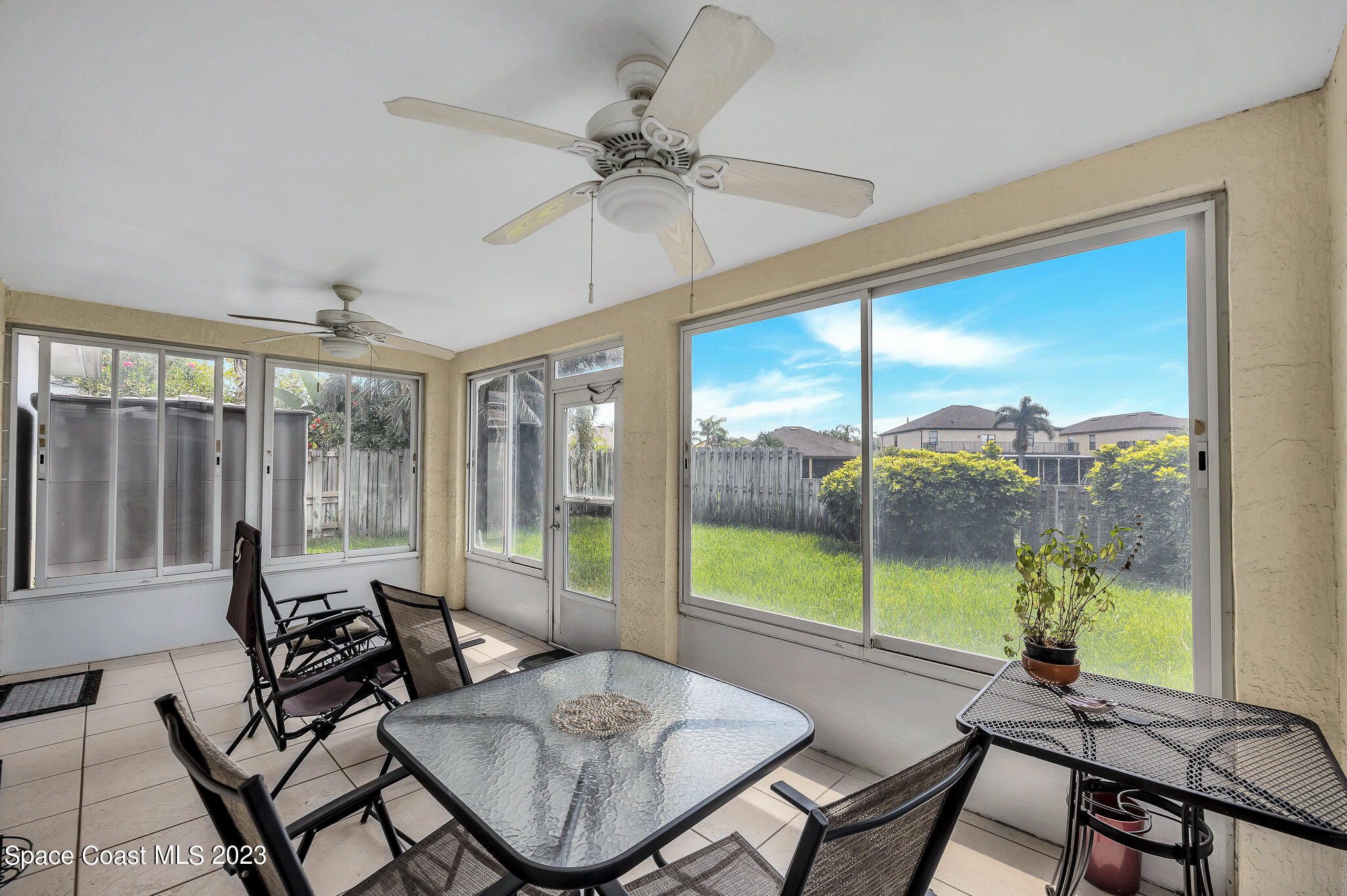 1149 White Oak Circle Melbourne, FL 32934 - Photo 19 of 55 a view of a dining room with furniture window and outside view
