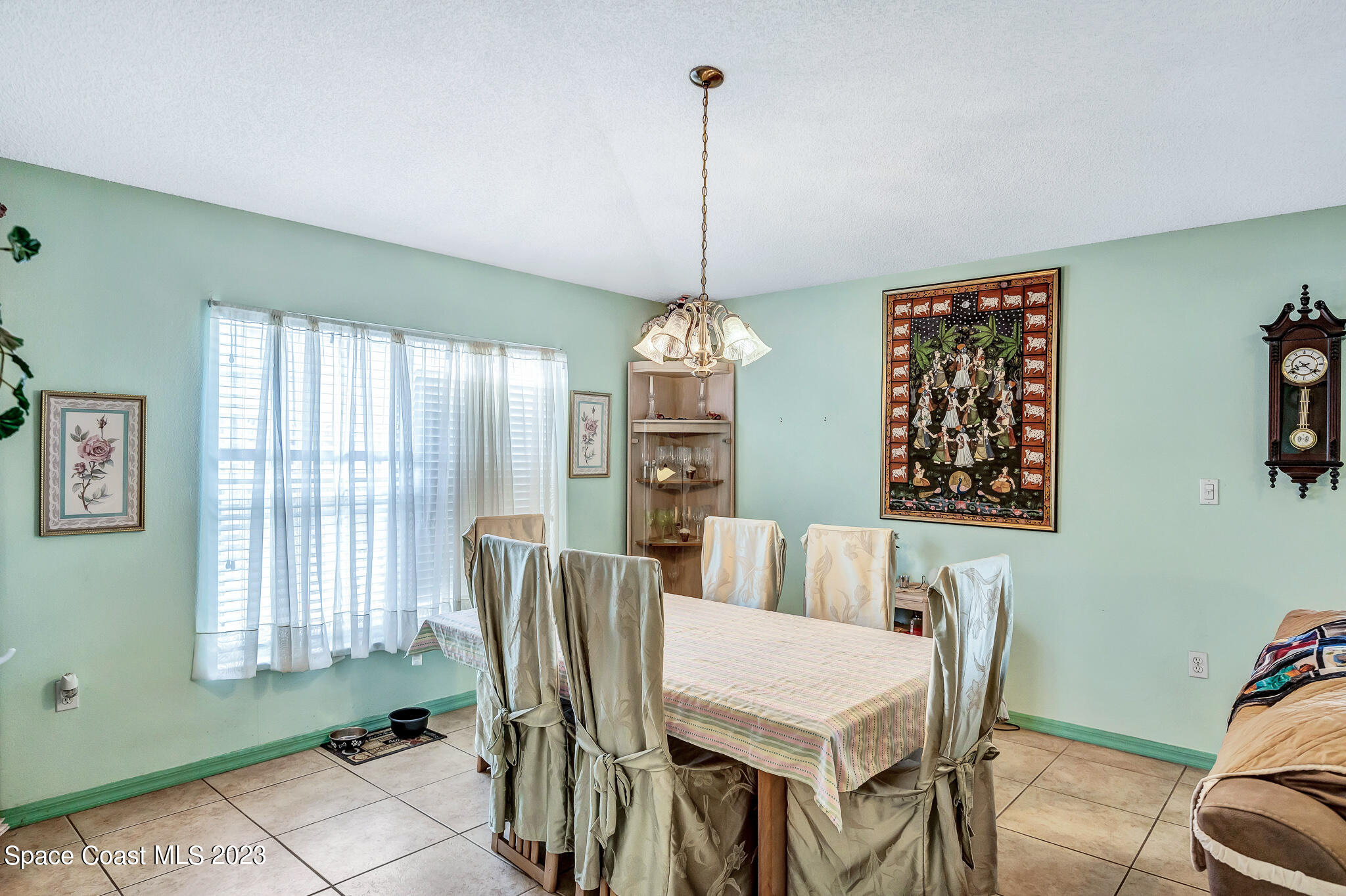 1149 White Oak Circle Melbourne, FL 32934 - Photo 21 of 55 a view of a dining room with furniture window and outside view
