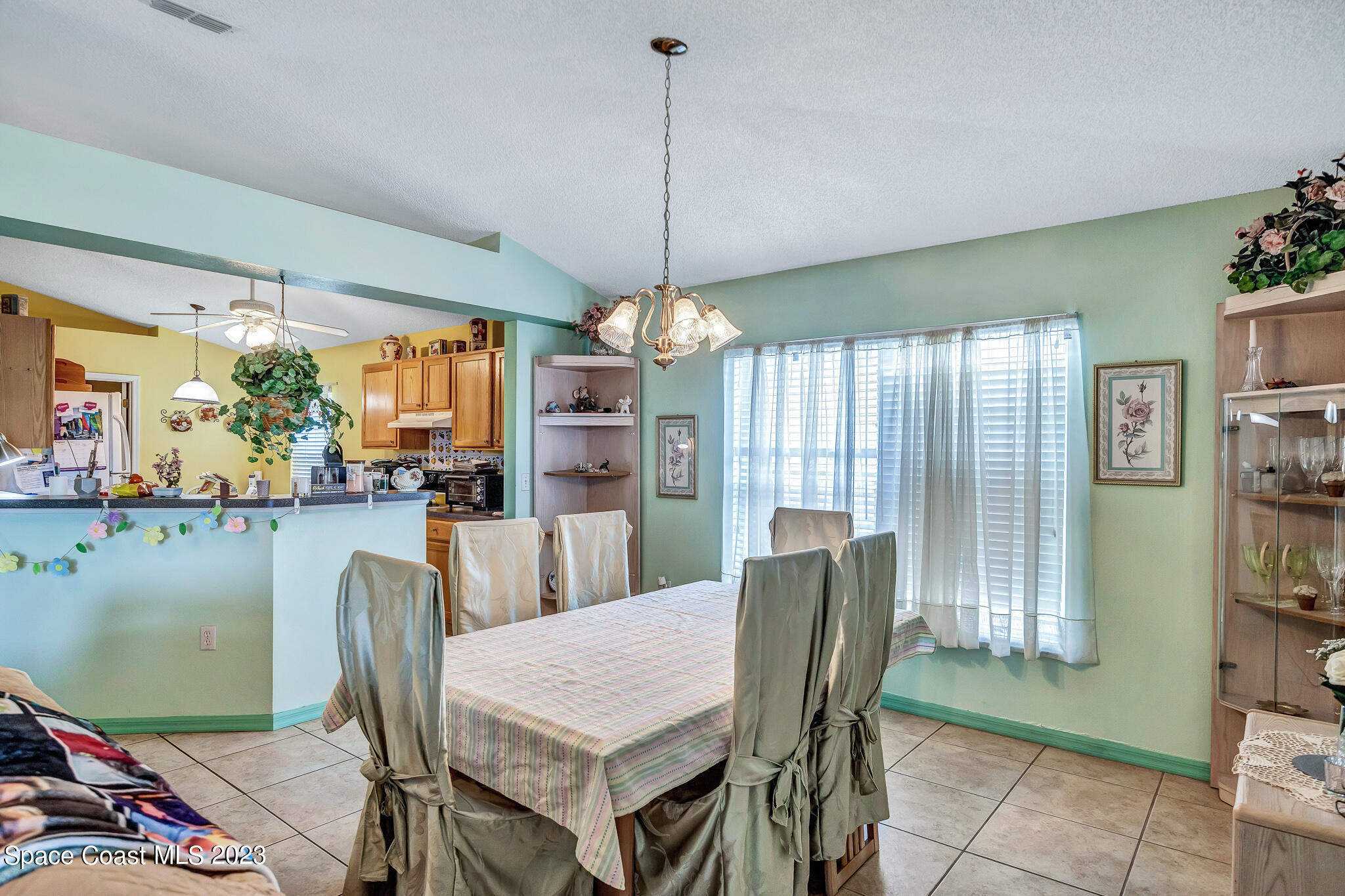 1149 White Oak Circle Melbourne, FL 32934 - Photo 22 of 55 a dining room with furniture and window