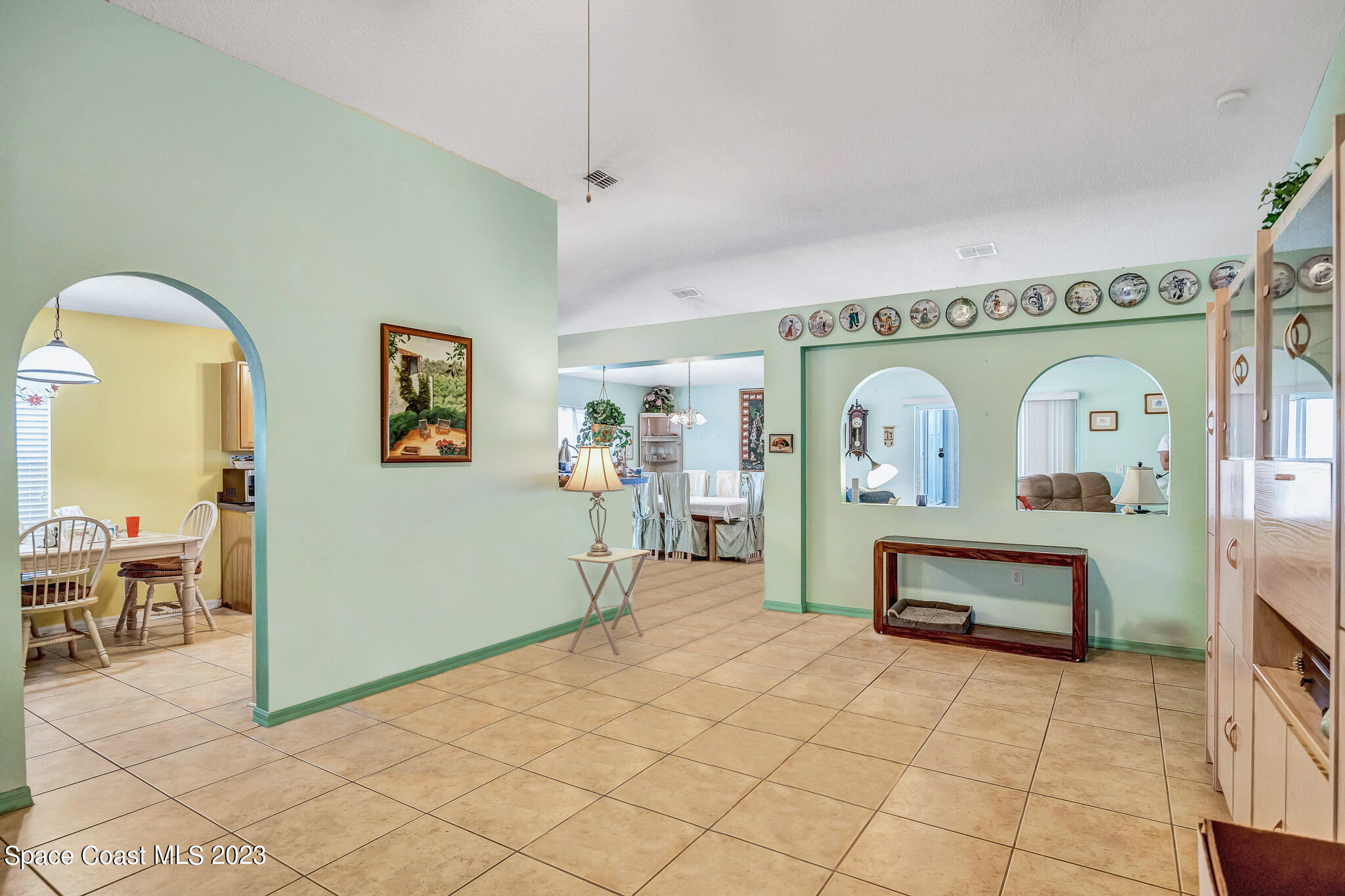 1149 White Oak Circle Melbourne, FL 32934 - Photo 24 of 55 a view of living room filled with furniture and window