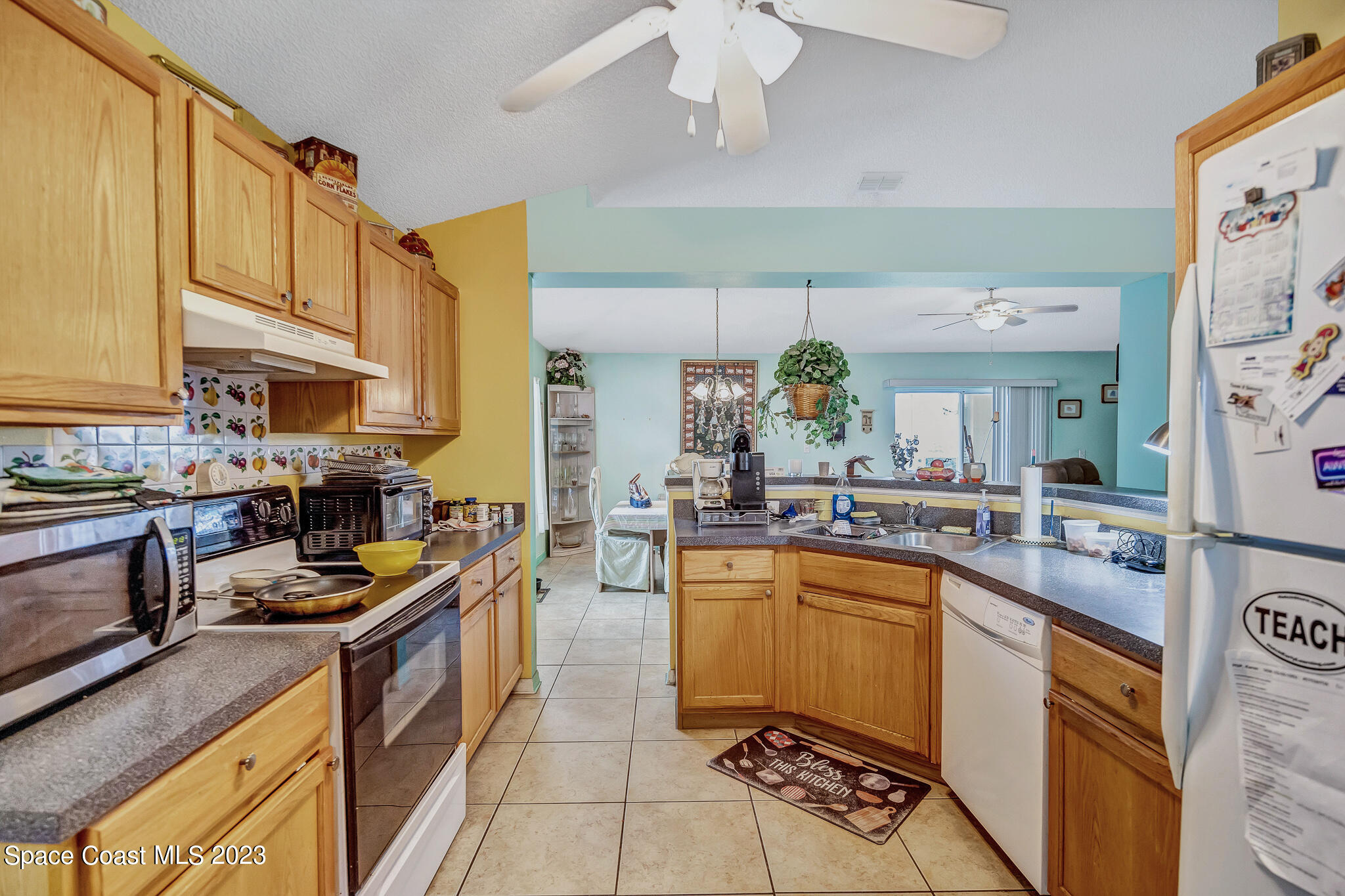 1149 White Oak Circle Melbourne, FL 32934 - Photo 29 of 55 a kitchen with lots of counter top space and stainless steel appliances