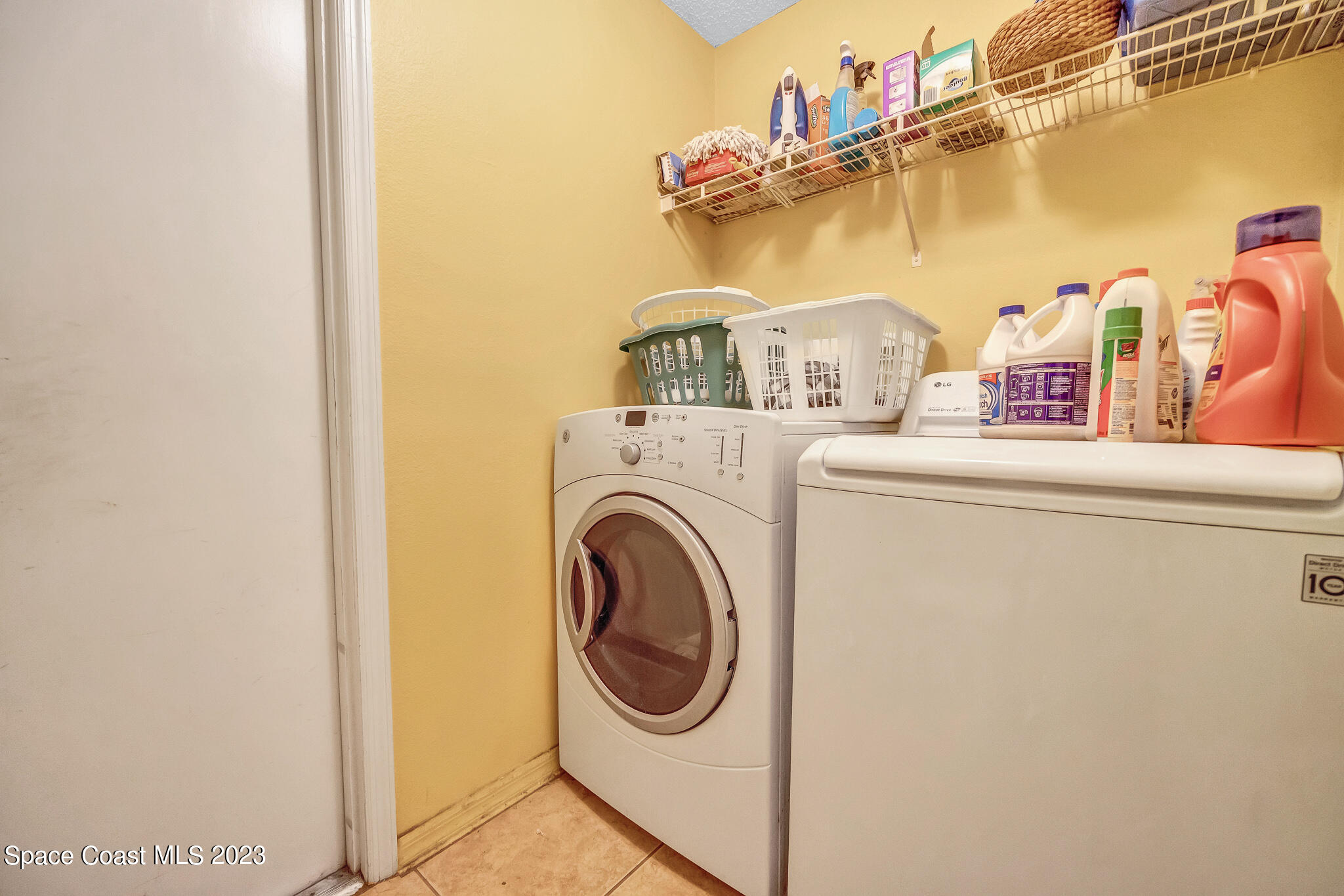 1149 White Oak Circle Melbourne, FL 32934 - Photo 31 of 55 a utility room with dryer and washer