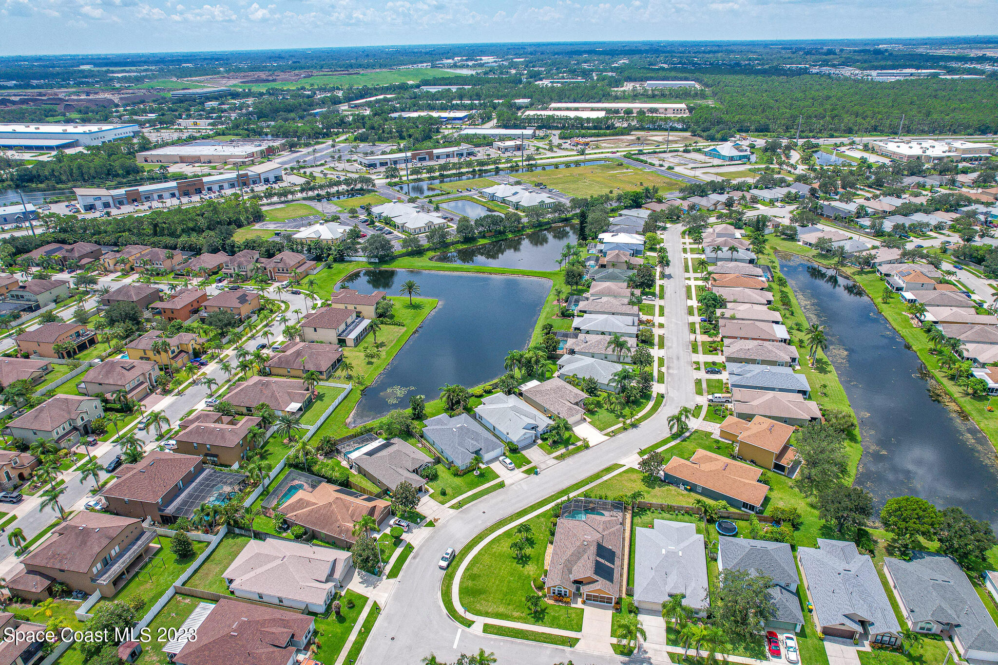 1149 White Oak Circle Melbourne, FL 32934 - Photo 45 of 55 an aerial view of residential houses with outdoor space and river view