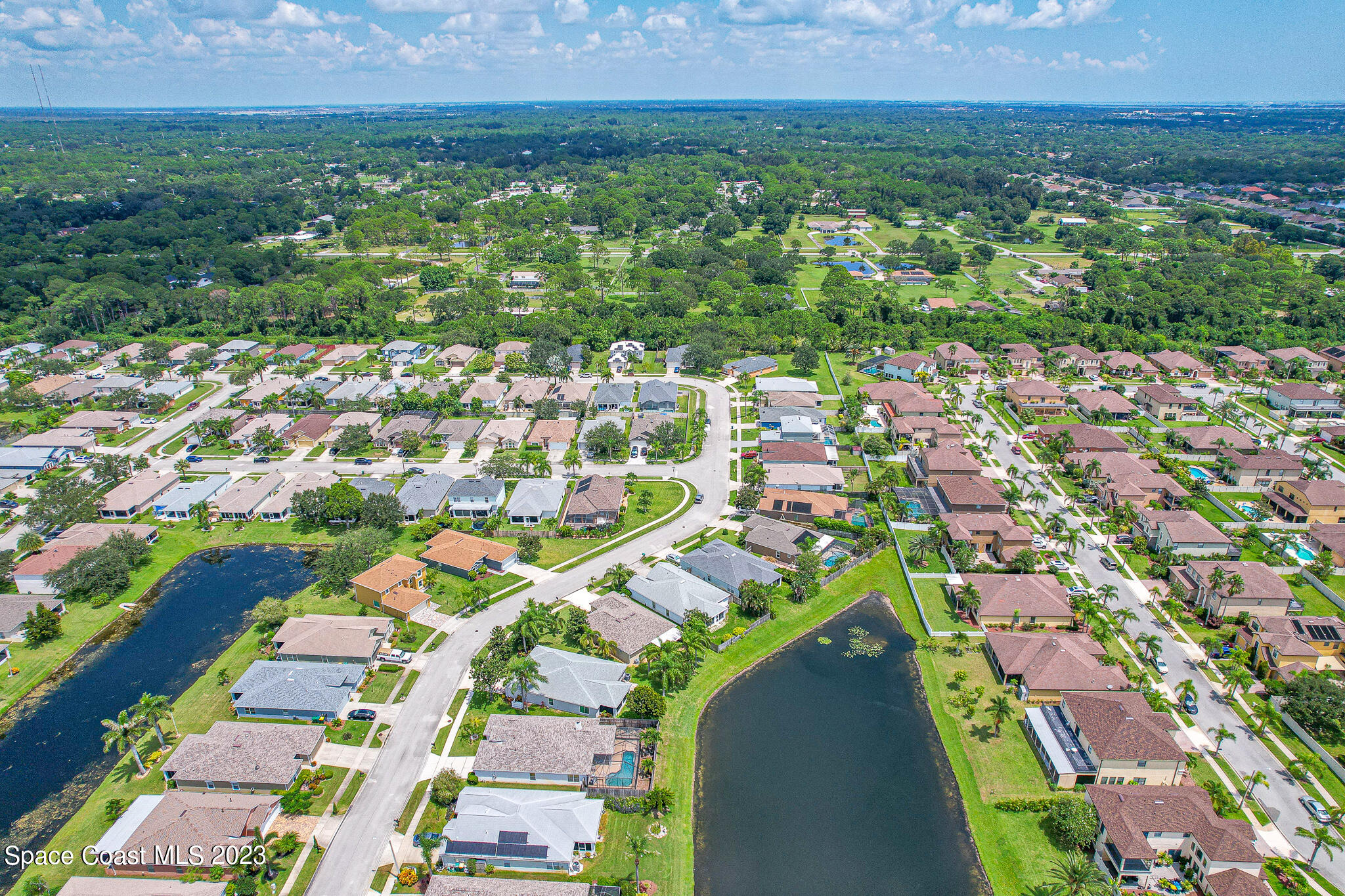 1149 White Oak Circle Melbourne, FL 32934 - Photo 47 of 55 an aerial view of residential houses with outdoor space